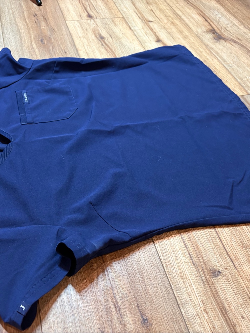 Jaanuu Women's Helia V-Neck Scrub Top in the color Midnight Navy - Picture 7 of 7